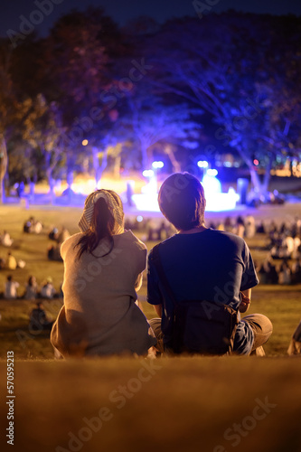 silhouette of young couple enjoying on outdoor romance concert at night © jaboo_foto