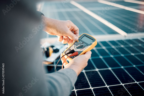 Tela Solar panels, multimeter and engineering hands for voltage check, installation or maintenance