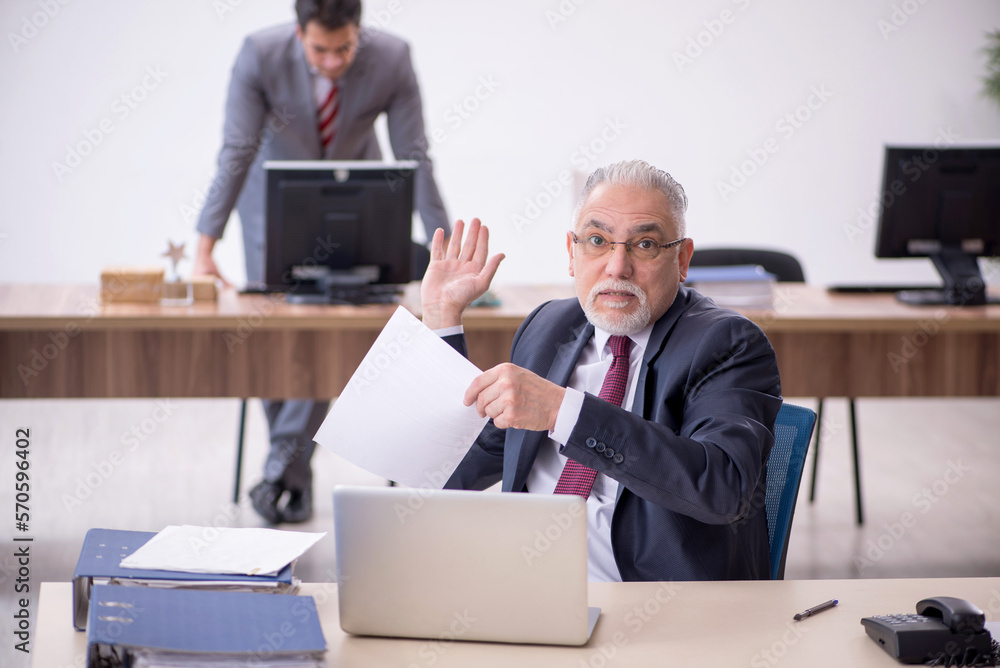 Two male colleagues working in the office Two male colleagues working in the office
