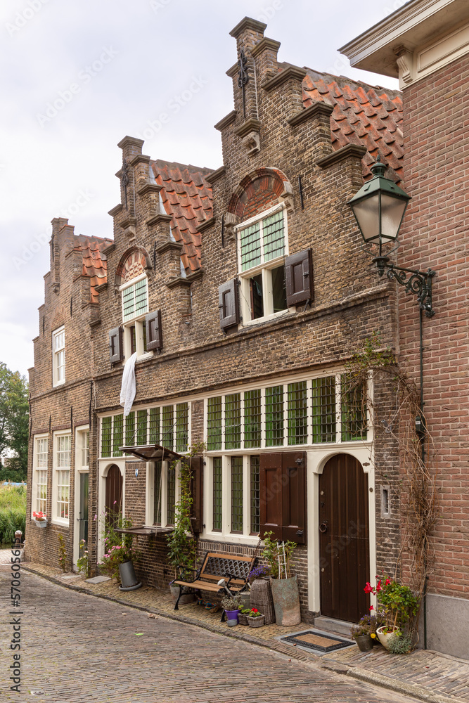 Fototapeta premium Old 17th century houses that were used as small shops at the time in the picturesque Dutch town of Oudewater.