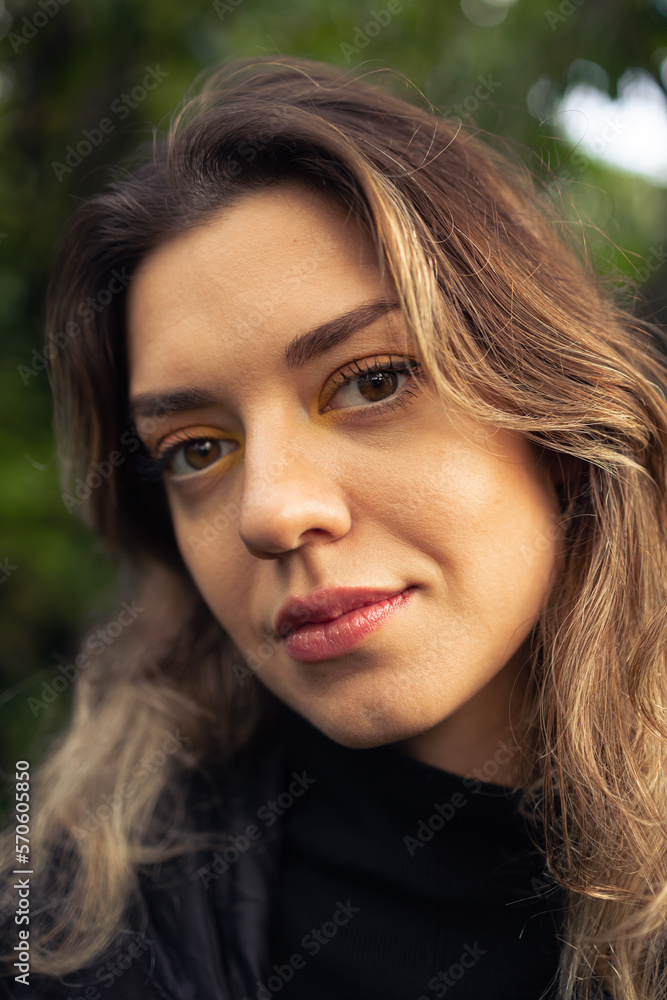 Close up photo of young beautiful woman. She has colorful make up and good skin. Close up photo of young beautiful woman. She has colorful make up and good skin.