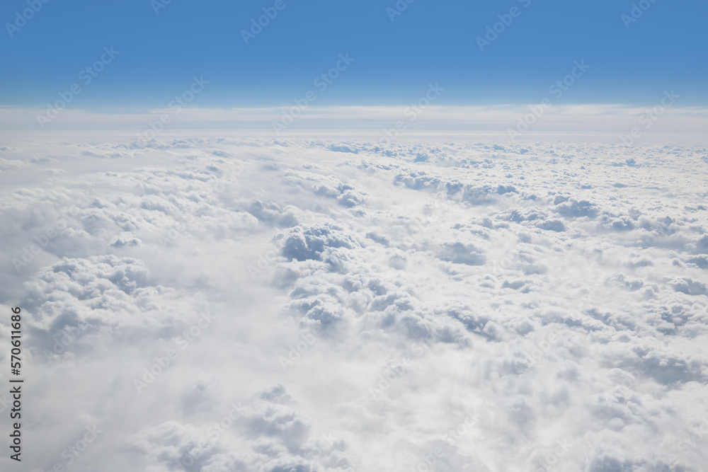 Clouds outside the window in an airplane in flight Clouds outside the window in an airplane in flight