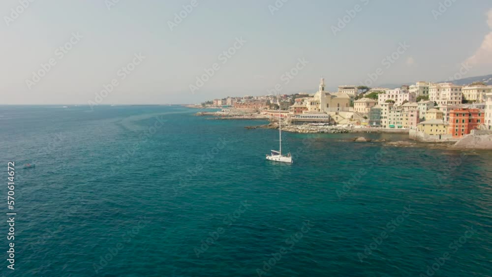 Scenic Coastline of Mediterranean city in Summer in Genoa, Italy, Europe. Panoramic view of Boccadasse town and Blue Sea Landscape. Urban tourism, Holiday and Travel time. 4k drone shot Scenic Coastline of Mediterranean city in Summer in Genoa, Italy, Europe. Panoramic view of Boccadasse town and Blue Sea Landscape. Urban tourism, Holiday and Travel time. 4k drone shot