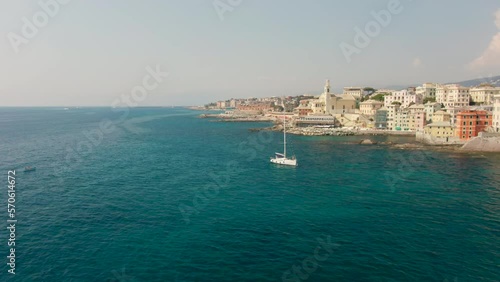 Wallpaper Mural Scenic Coastline of Mediterranean city in Summer in Genoa, Italy, Europe. Panoramic view of Boccadasse town and Blue Sea Landscape. Urban tourism, Holiday and Travel time. 4k drone shot Torontodigital.ca