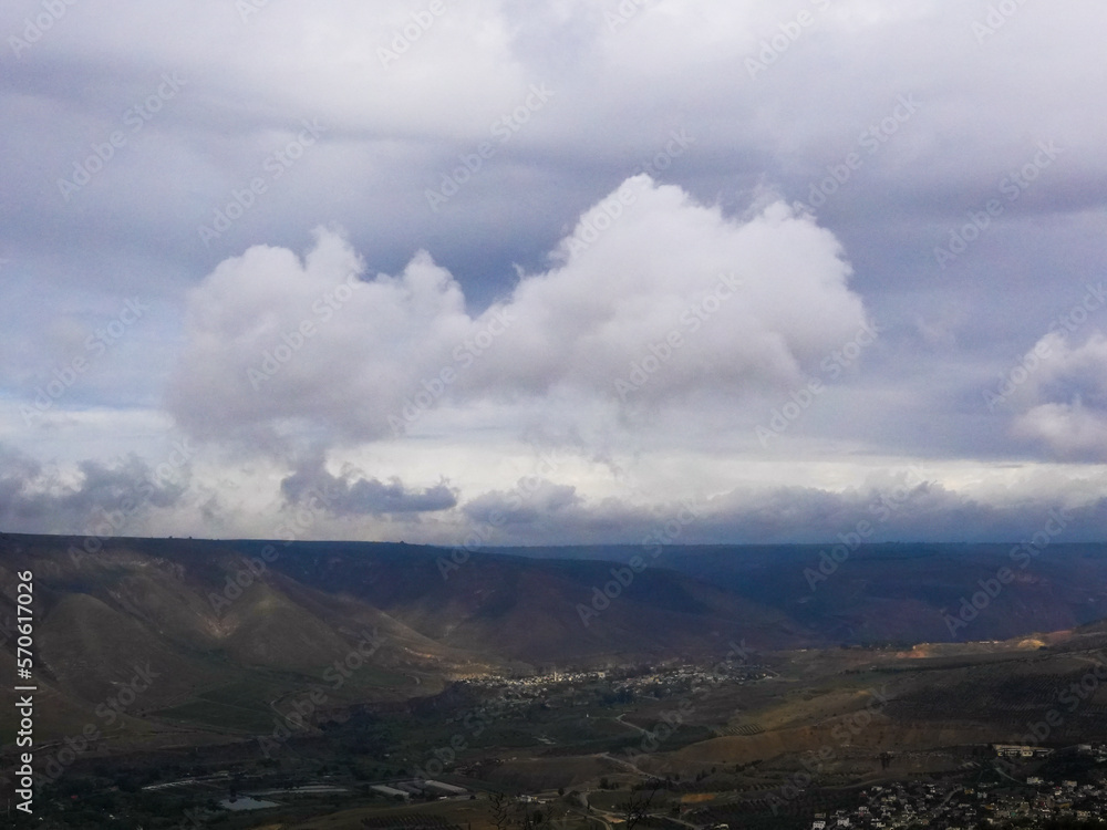 umm qais - irbid, jordan 06- Feb- 2023  - cloud layers and green mountains