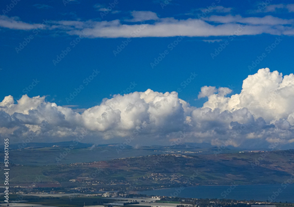 umm qais - irbid, jordan 06- Feb- 2023 
 - View of the city of Tiberias and The Sea of Galilee in Israel with blue sky and light clouds