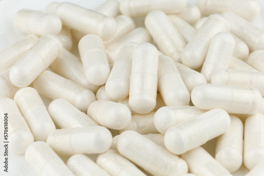 Magnesium mineral in white capsules Magnesium mineral in white capsules