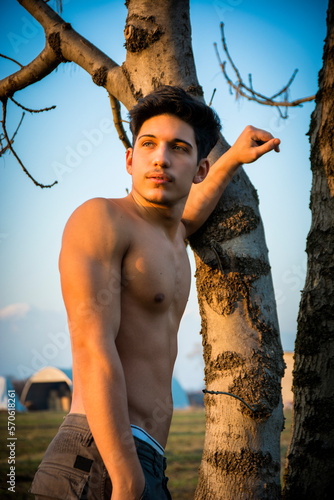 Handsome Muscular Shirtless Young Man Outdoor in the Country