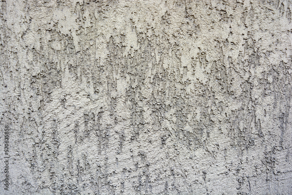 Building backgrounds, wall cladding made with brown textured and structural plaster in the form of bark on the wall of one of the houses in the city of Dnipro, Ukraine. Building backgrounds, wall cladding made with brown textured and structural plaster in the form of bark on the wall of one of the houses in the city of Dnipro, Ukraine.