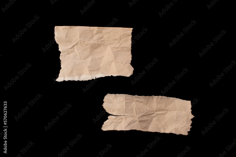Crumpled torn paper pieces isolated on black background Crumpled torn paper pieces isolated on black background