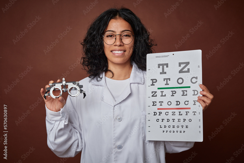 Optometrist checking a patient's vision with glasses and a test. Optometrist checking a patient's vision with glasses and a test.