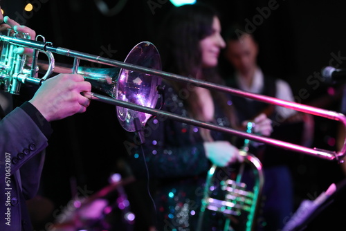 Canvas Print Group of jazz musicians playing on the stage on a wind musical instrument trumpe