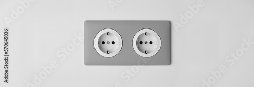 Stylish gray Electric Outlet. Power outlet on the wall. Euro type electric outlet on wall.