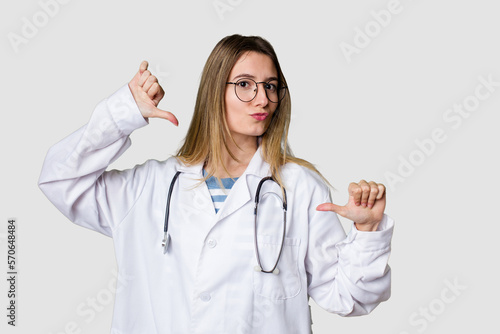 Compassionate female physician with a stethoscope around her neck  ready to diagnose and care for her patients in her signature white coat feels proud and self confident  example to follow.