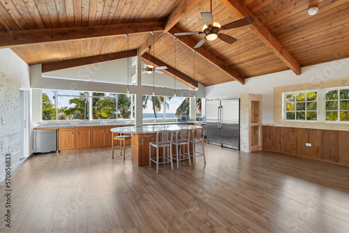 Vacant empty Interior wood beam tongue and groove ceiling and floors.