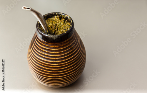 Yerba mate matero. Sout America popular hot drink. Couple drinking healthy herbal beverage tea photo