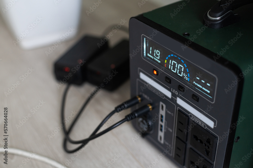 Portable Power Station is charging gadgets. Modern, information technology. Control panel. close up. Portable Power Station is charging gadgets. Modern, information technology. Control panel. close up.