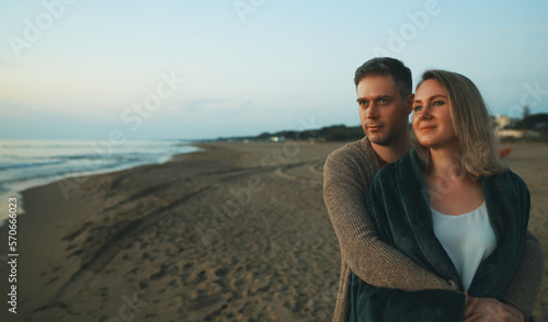 Attractive couple at sunset by the sea. © M-Production