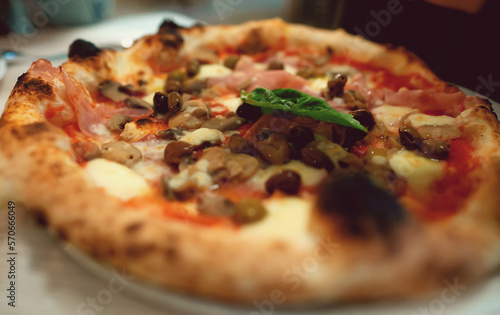 Pizza capricciosa. Pizza with ham, olives, mushrooms and artichokes.