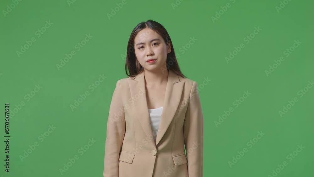 Tired Asian Business Woman While Standing In Front Of Green Screen
Tired Asian Business Woman While Standing In Front Of Green Screen