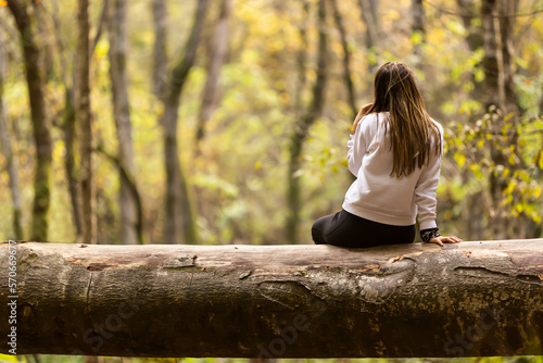 Woman watching nature in the forest