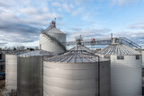 Industrial storage or silo tanks in a row with copy space above