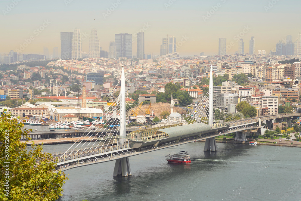 Obraz premium Aerial view of Golden Horn Metro Bridge, or Halic Metro Koprusu, before sunset, Istanbul city, Turkey