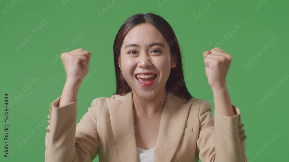 Close Up Of Happy Asian Business Woman Celebrating While Standing On Green Screen In The Studio
Close Up Of Happy Asian Business Woman Celebrating While Standing On Green Screen In The Studio