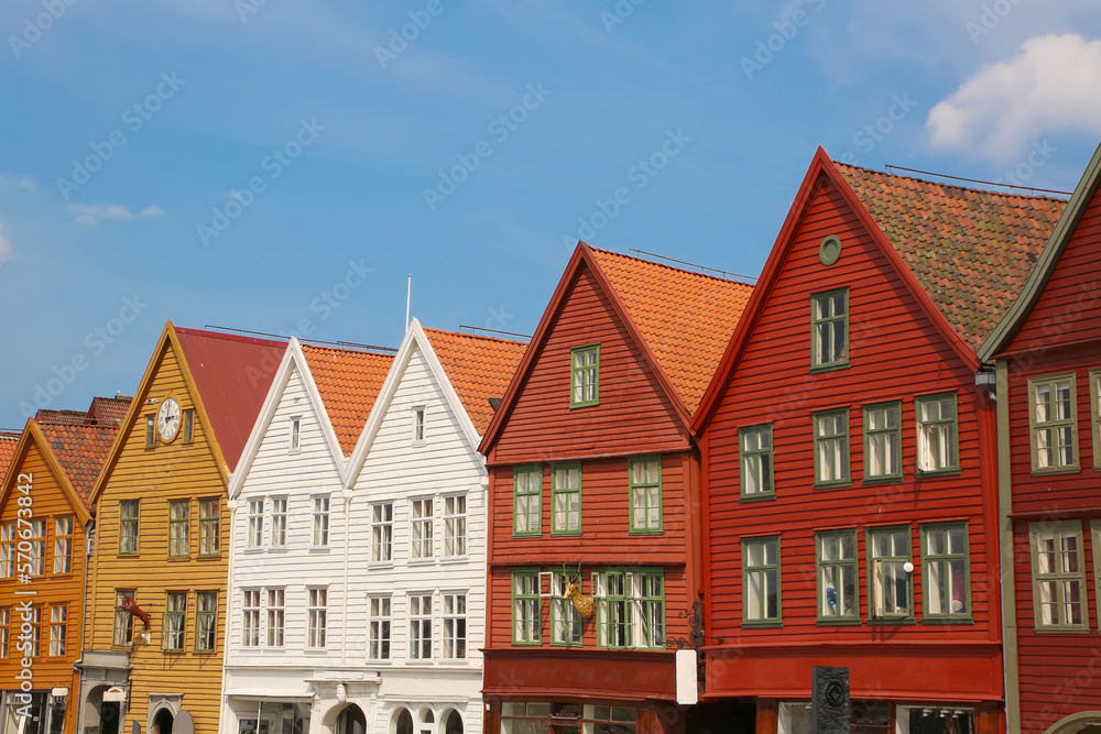 Colourful wooden houses of Bryggen the old wharf historic harbour district of Bergen, Norway. Its a Unesco World heritage listed and was rebuilt after being destroyed in a fine.