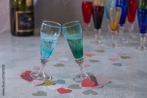 Clinking glasses celebrating love on a party table 