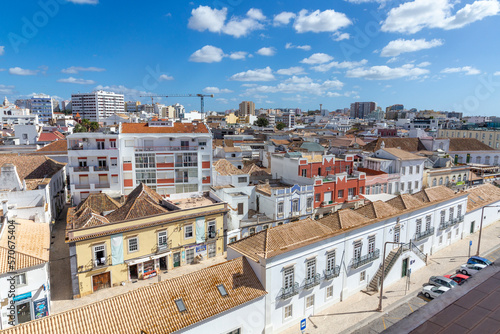 view to old town of Faro, Portugal, Algarve with mixture of modern and old traditional architecture.