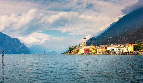 Malcesine, Italy. Ancient tower and fortress in the old town of Malcesine on Lake Garda, Veneto region, Italy. Summer landscape with colorful houses and beautiful sky. Veneto region, Italy. 