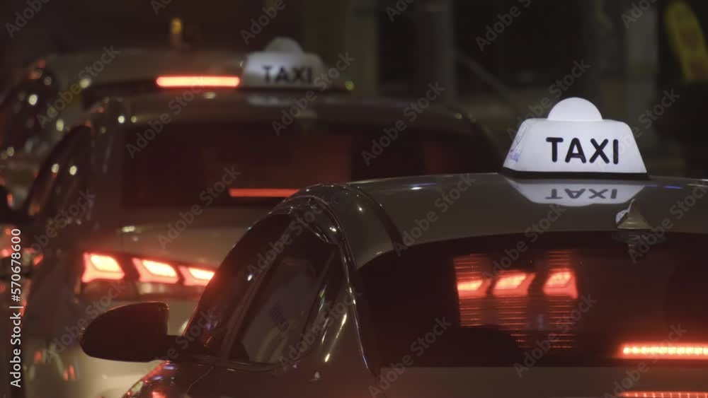A busy street at night with cars stuck in a traffic jam. A busy street at night with cars stuck in a traffic jam.