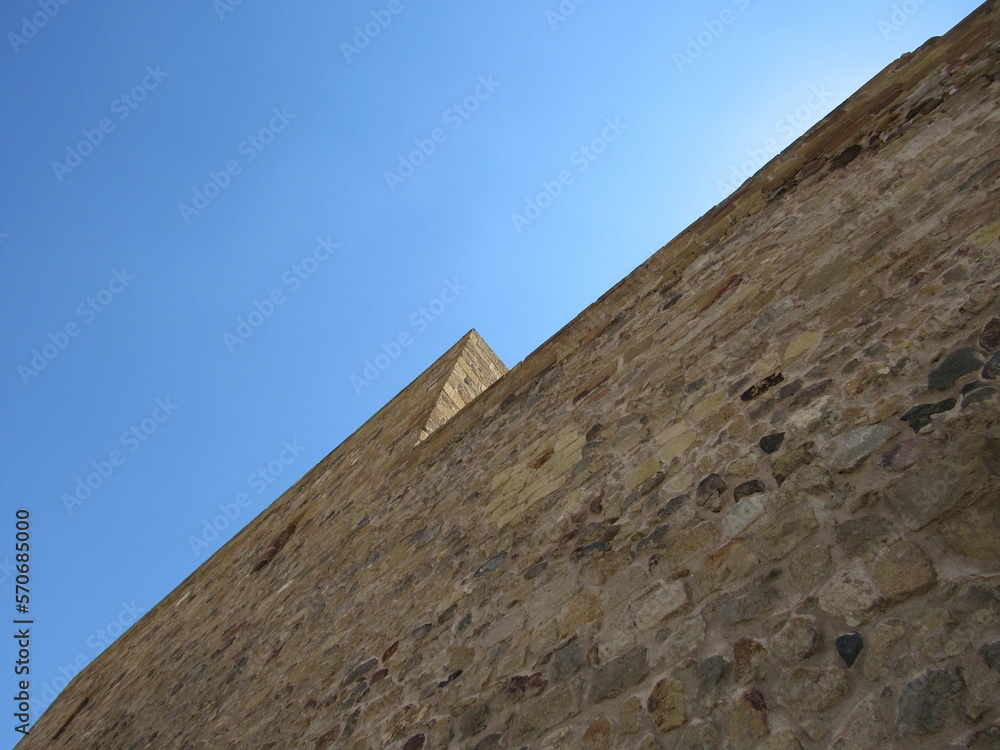 A castle wall with a contrast to blue sky