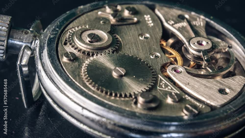 Timelapse of mechanism of vintage stopwatch with rotation closeup