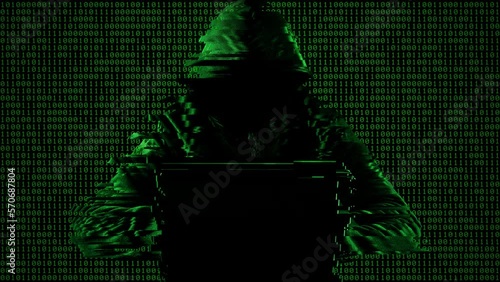 Hacking and technology crime concept. No face hacker with laptop with abstract programming code elements.