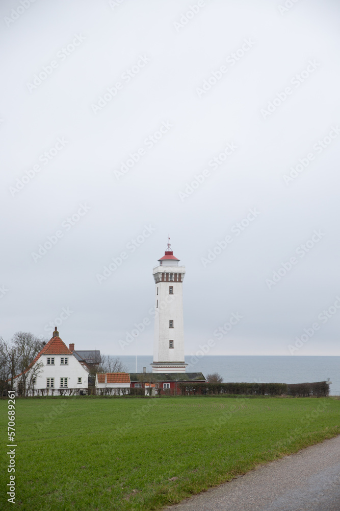 The beautiful white lighthouse at Helnæs in Denmark The beautiful white lighthouse at Helnæs in Denmark