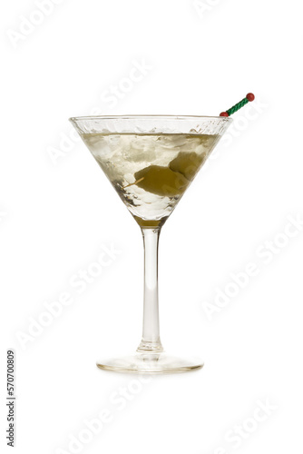 Cocktail glass with green olives inside