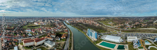 Aerial panoramic view of Oradea Nagyvarad on the Crișul Repede river with medieval pentagonal fortress, secessionist building in downtown, synagogue tower, waterpark photo