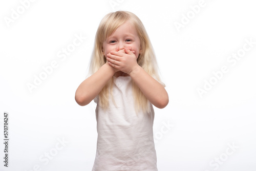 Little scared or crying or playing bo-peep girl hiding face. Isolated on white.