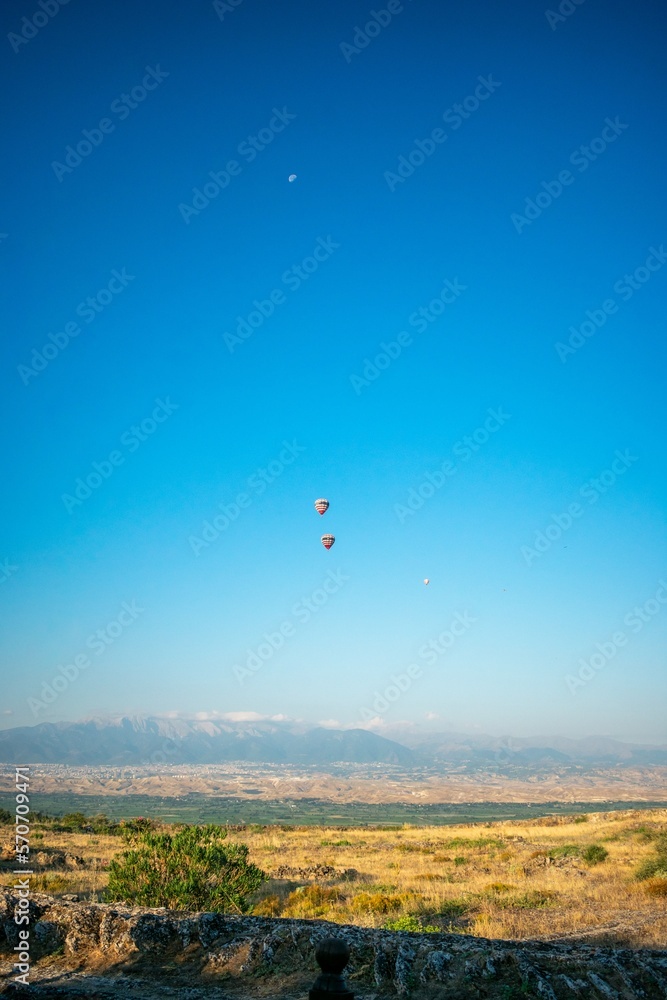 two balloons in blue hierapolis sky turkey two balloons in blue hierapolis sky turkey