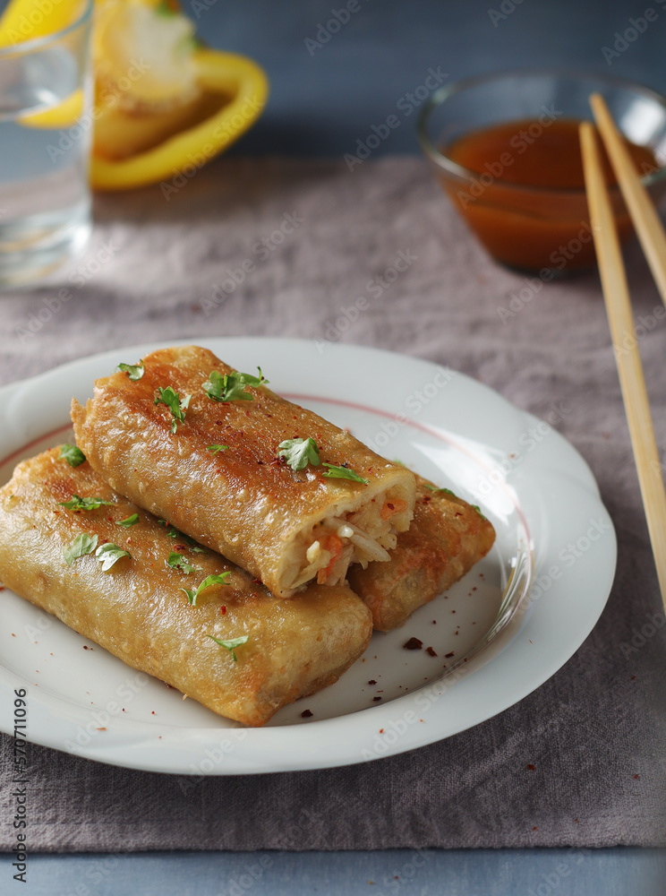 Spring rolls - a typical dish in Chinese and other Southeast Asian cuisines Spring rolls - a typical dish in Chinese and other Southeast Asian cuisines