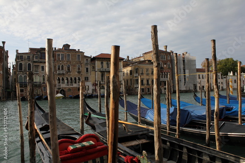 Venetian gondolas docked in the harbor on a windy day photo