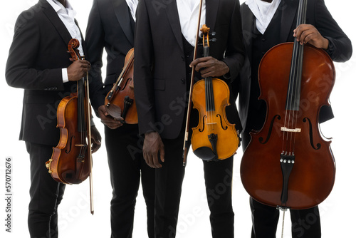 Musical instruments in hands of a string quartet on a white background. African americans. Closeup photo