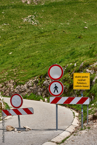 Traffic signs forbidding access to Mangartsko Sedlo because of rockfall danger, Slovenia photo