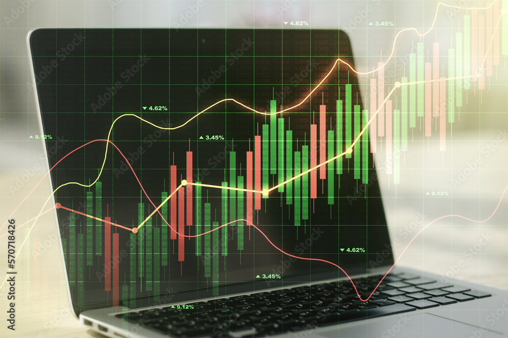Multi exposure of abstract financial graph on laptop background, financial and trading concept Multi exposure of abstract financial graph on laptop background, financial and trading concept