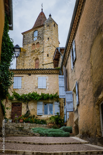 Fototapeta Naklejka Na Ścianę i Meble -  View on the paved quaint street of Lavardens and the church bell tower in the South of France (Gers)