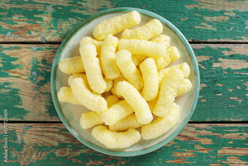 Corn puffs on a plate photo