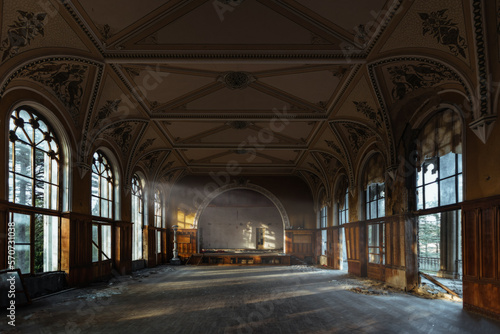 Large hall of abandoned building in gothic style © Mulderphoto