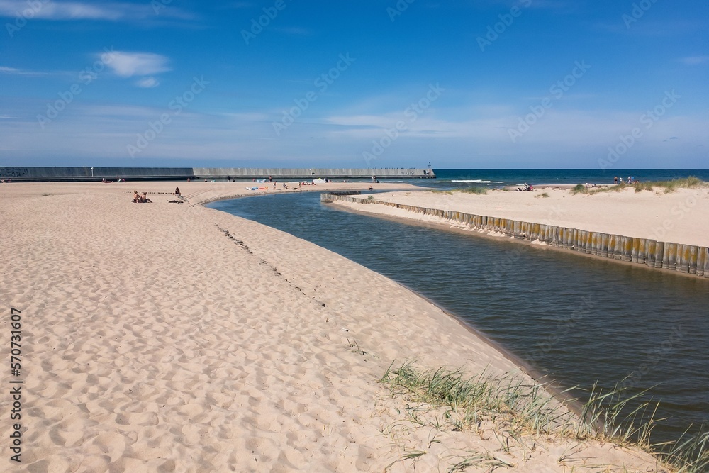 Jamienski Nurt sand beach at water canal near Jamno lake in Poland Jamienski Nurt sand beach at water canal near Jamno lake in Poland
